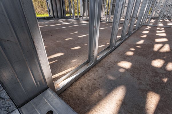 new technology steel frame for construction. new home under construction using steel frames against cloudy sky